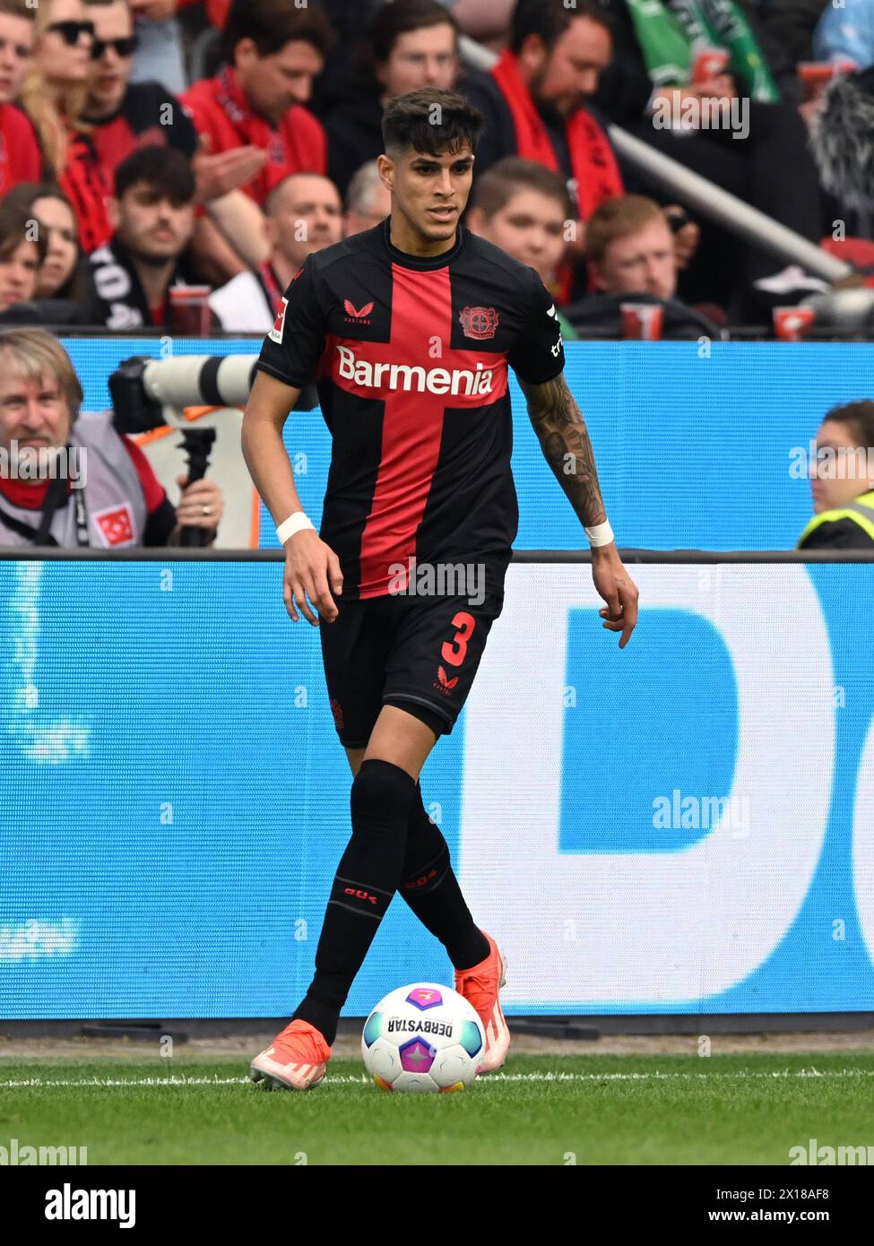 LEVERKUSEN - Piero Hincapie of Bayer 04 Leverkusen during the Bundesliga match between Bayer 04 Leverkusen and Werder Bremen at the Bay Arena on April 14, 2024 in Leverkusen, Germany. ANP | Hollandse Hoogte | GERRIT VAN COLOGNE Stock Photo