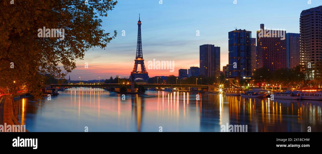 Amazing panoramic image of sunrise at the Eiffel tower in spring in Paris. Stock Photo