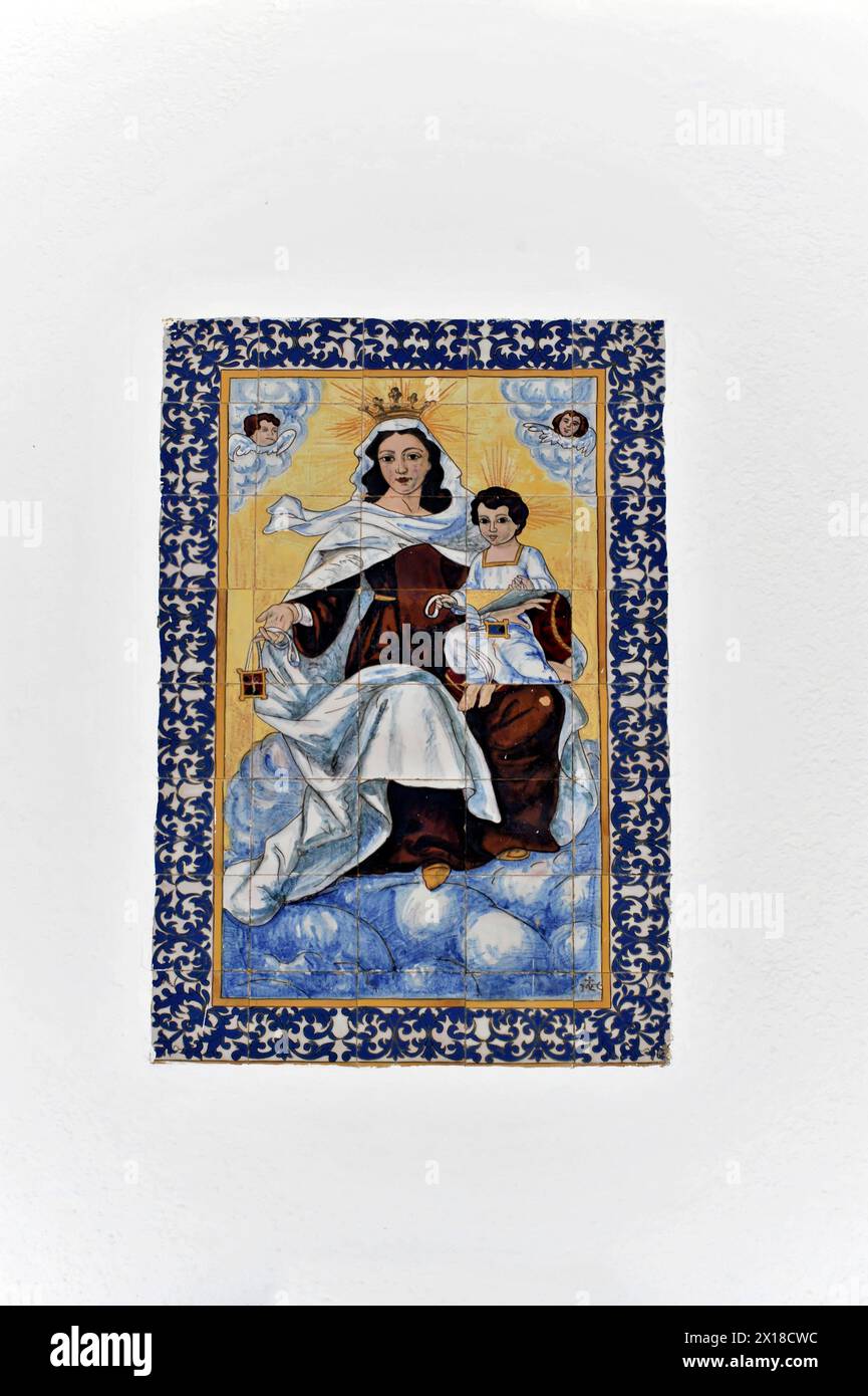 Sanlucar de Barrameda, Province of Cadiz, In the centre of a white wall is an artistic, blue and white tile with a pictorial representation Stock Photo