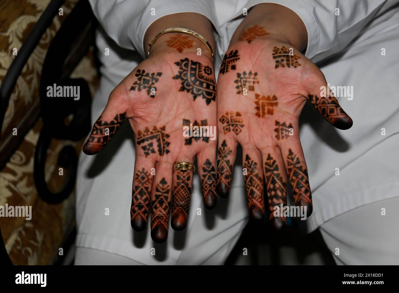 Marrakech, Opened hands show complex, traditional henna designs