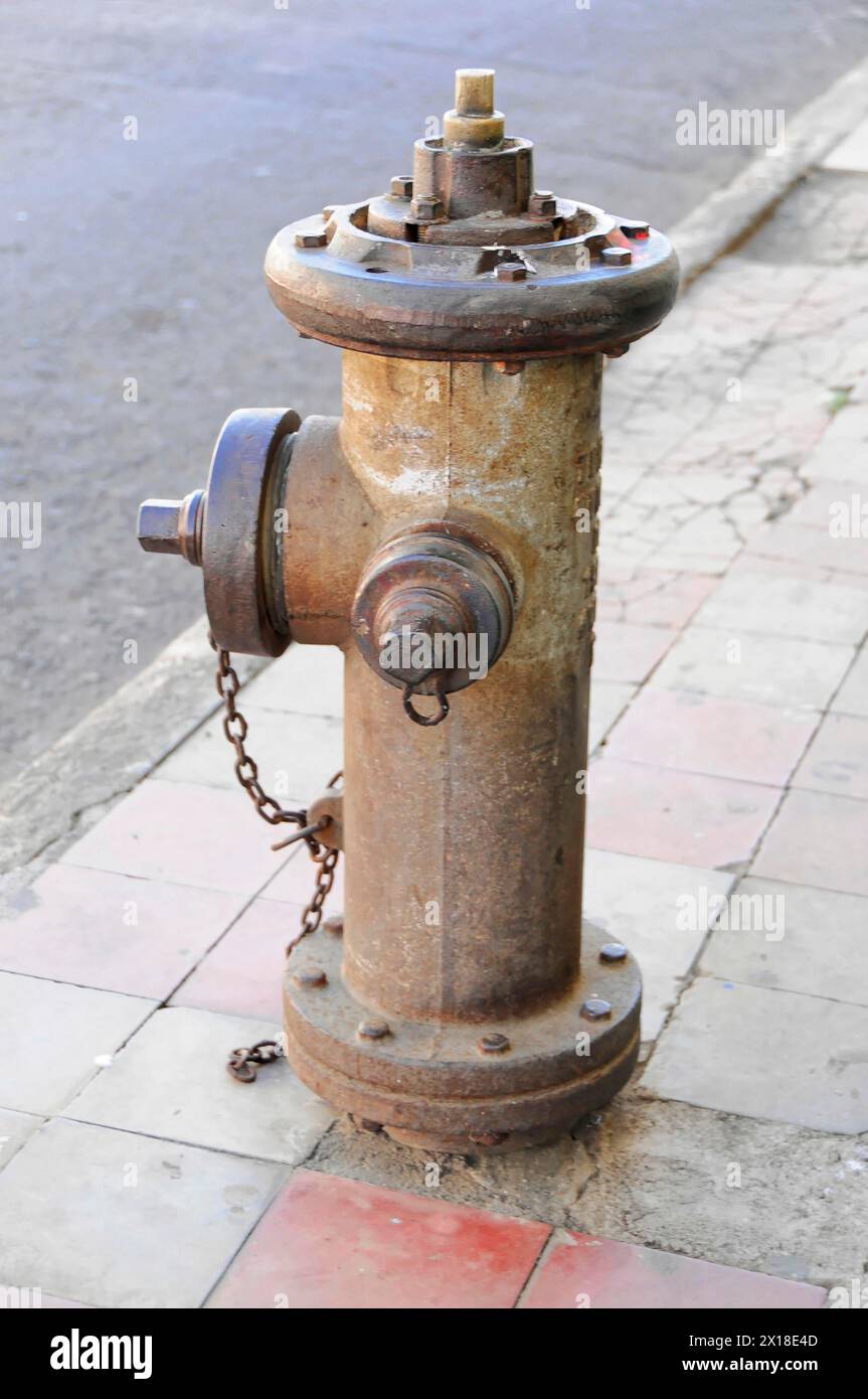 Leon, Nicaragua, An old rusty fire hydrant on a city street corner, Central America, Central America Stock Photo