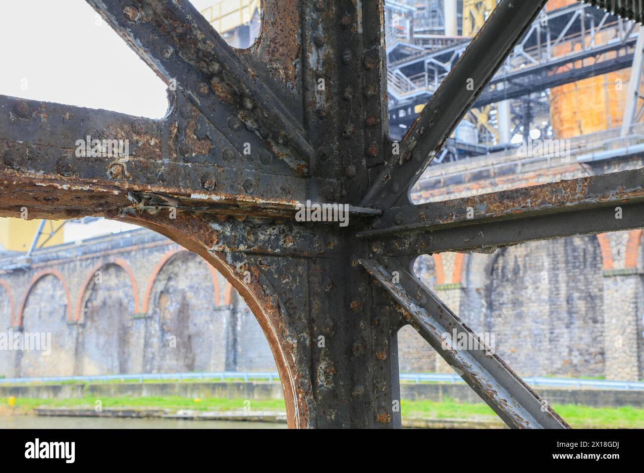 Rusty iron construction of a bridge, Solvay chemical plant for the production of bicarbonate and carbonate of soda or sodium carbonate Stock Photo