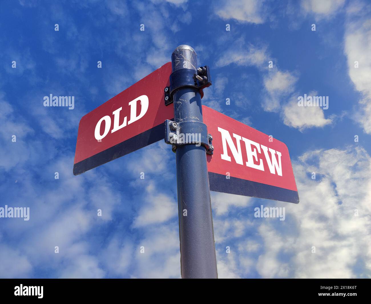 3d illustration, Old vs New. White two street signs with arrow on metal pole with word. Directional road. Crossroads Road Sign, Two Arrow. Blue sky ba Stock Photo