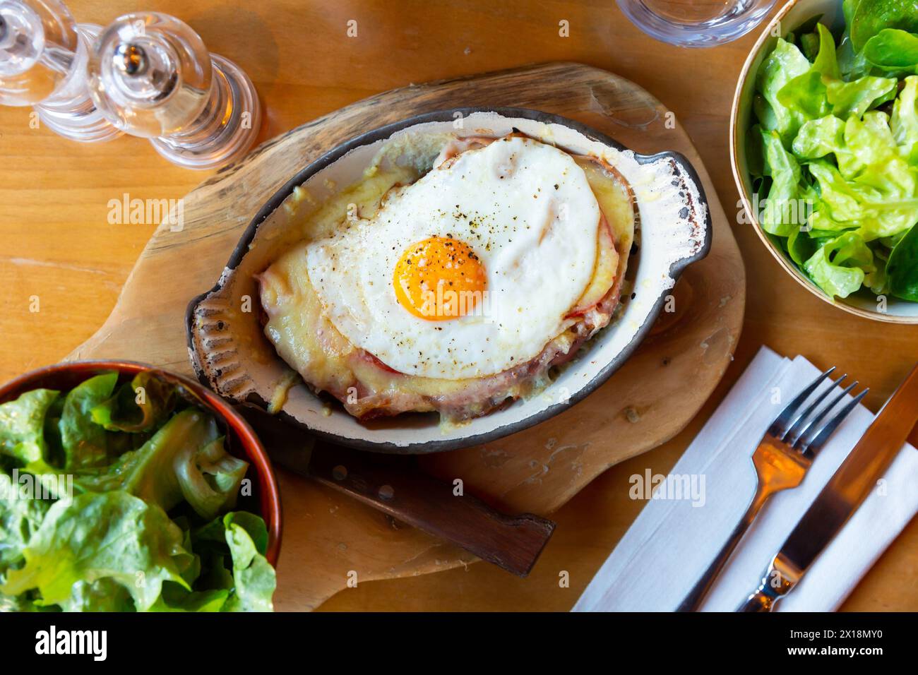 Swiss cheese crust with fried egg Stock Photo