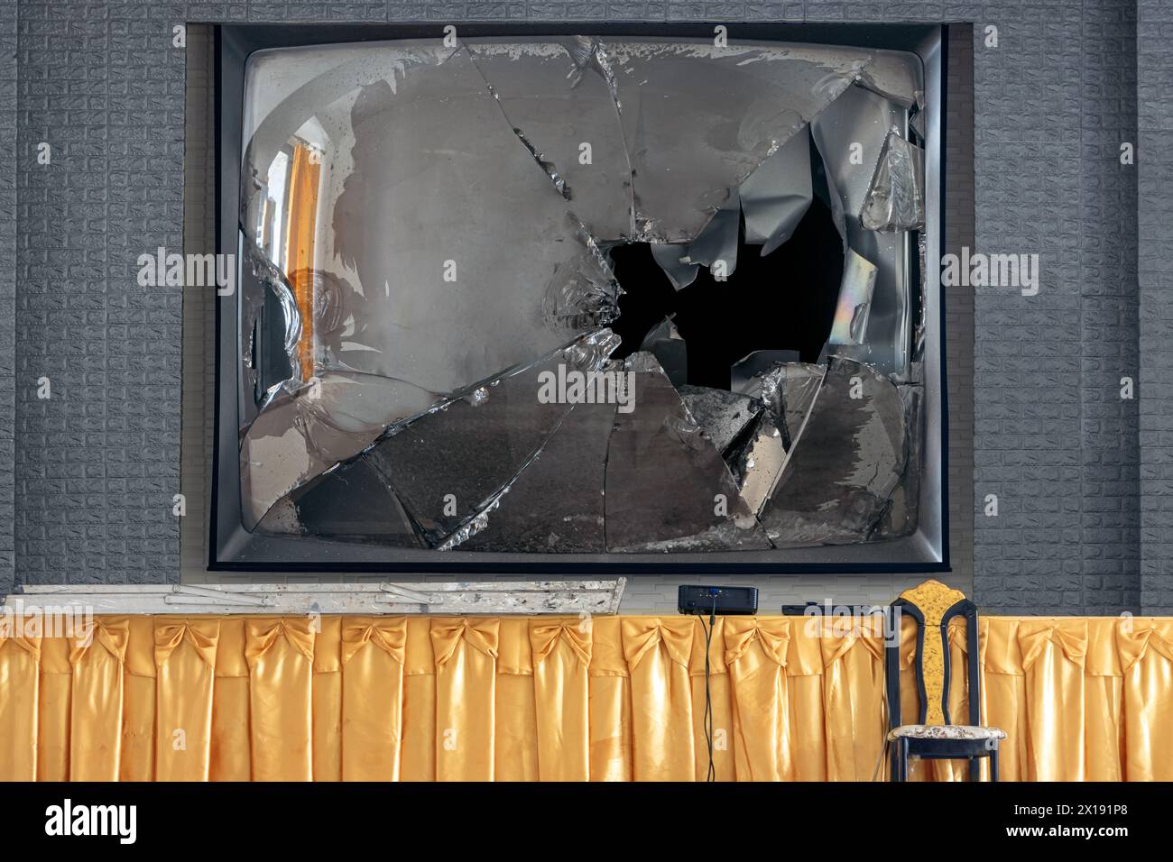 An empty stage with a broken big TV screen Stock Photo
