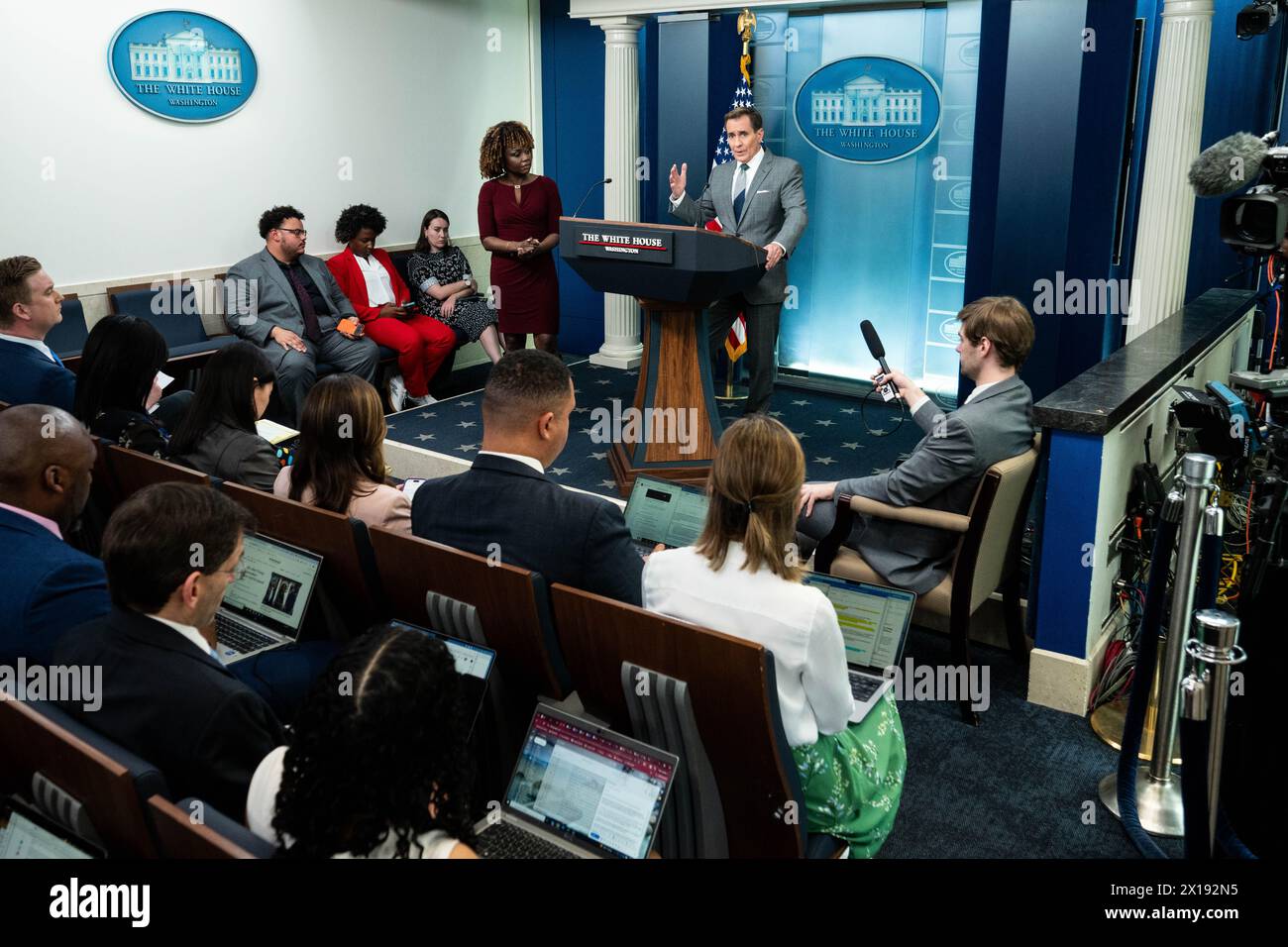 Washington, United States. 15th Apr, 2024. White House National Security Communications Advisor John Kirby (with White House Press Secretary Karine Jean-Pierre standing on the left) speaking at a press briefing in the White House Press Briefing Room in Washington, DC. Credit: SOPA Images Limited/Alamy Live News Stock Photo