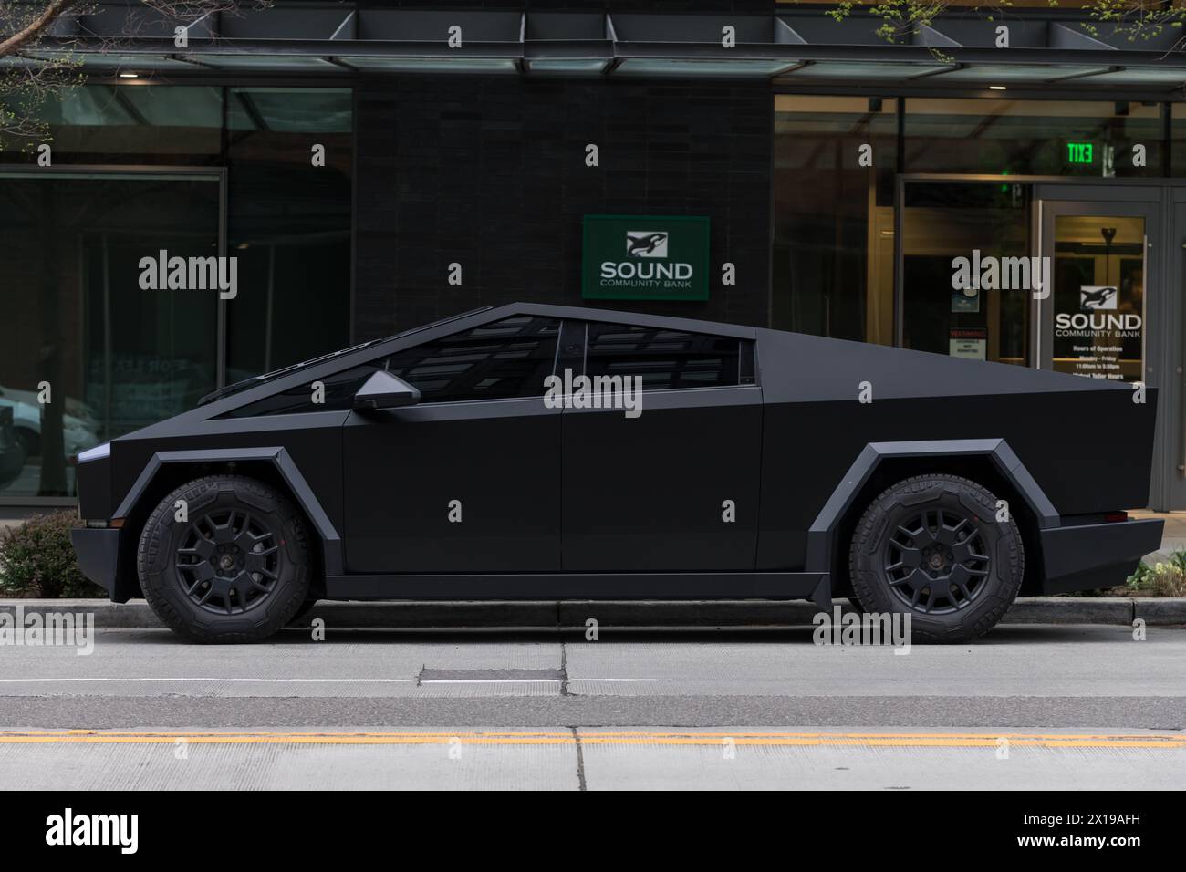 Seattle, USA. 15 Apr, 2024. A parked matte black wrapped Tesla ...