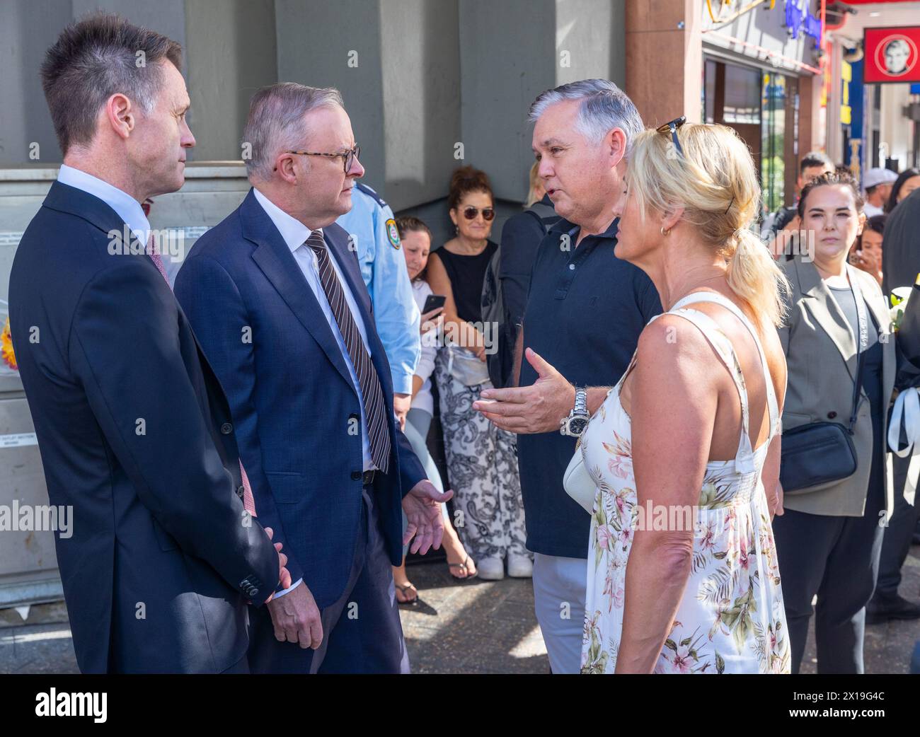 Sydney, Australia. 14 April 2024. Scenes from the aftermath of the deadly stabbing spree that occurred on 13 April 2024 in the Westfield Bondi Junction shopping centre. Pictured: NSW Premier Chris Minns (far left) and Australian Prime Minister Anthony Albanese (left) speaking to local witnesses. Stock Photo