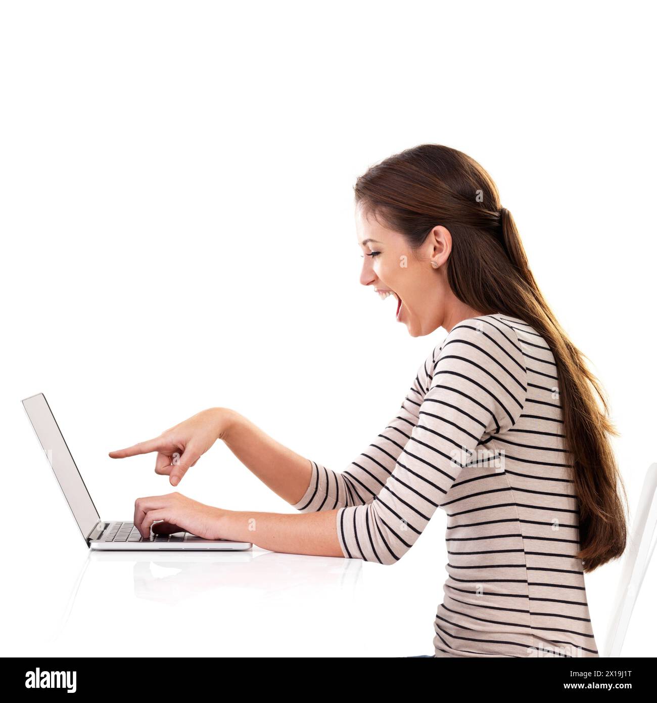 Wow, laptop and woman with hand pointing in studio for surprise news, gossip or online drama on white background. Omg, shock and model show computer Stock Photo