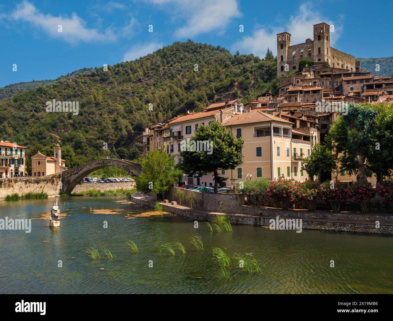 Old houses and stone bridge over small river in town of Dolceacqua in Liguria, Italy. Stock Photo