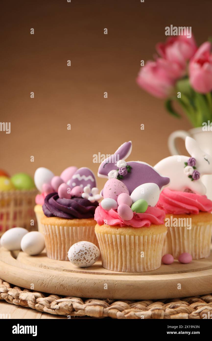Tasty cupcakes with Easter decor on table Stock Photo