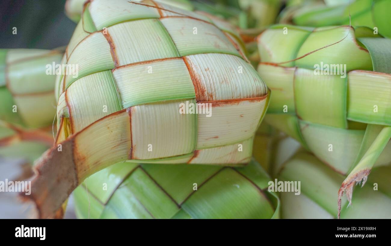 Ketupat or rice dumpling is indonesian traditional food serve on Eid Stock Photo