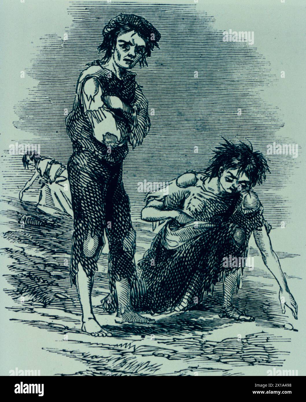 A starving boy and girl of Cahera, Ireland during the famine of 1847, illustration, England Stock Photo