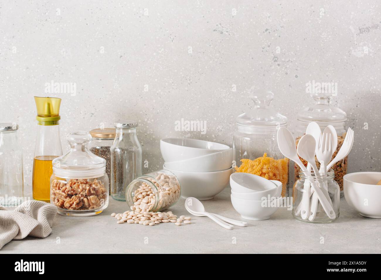 eco friendly kitchen storage. glass jars of grains , pasta and nuts