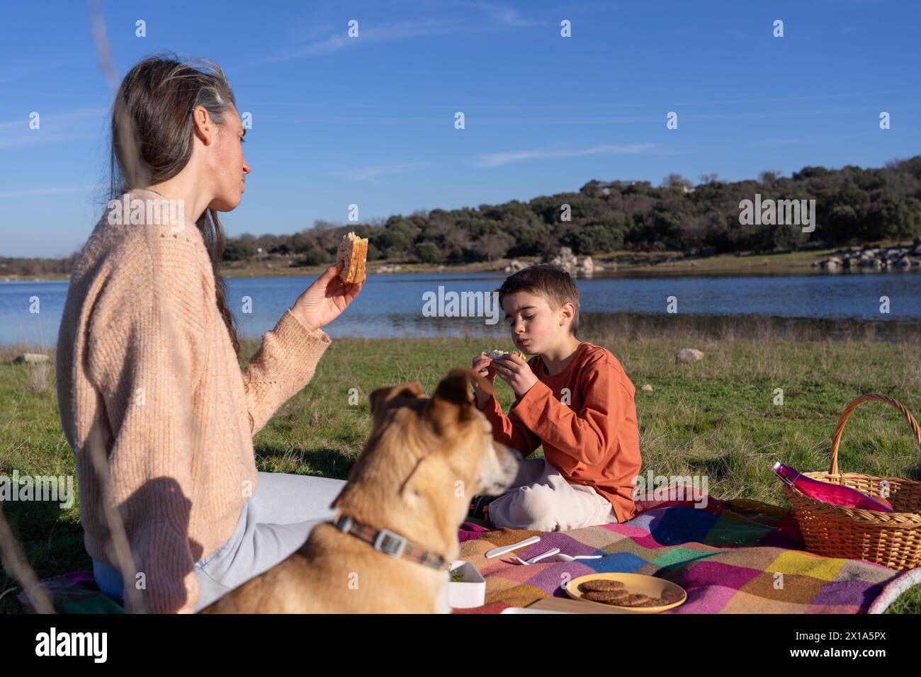 Family having picnic lake in hi-res stock photography and images - Alamy