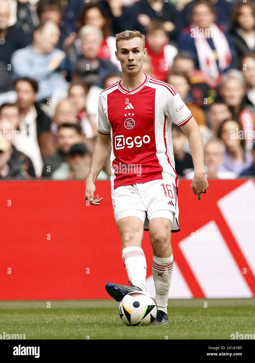 AMSTERDAM - Sivert Mannsverk of Ajax during the Dutch Eredivisie match between Ajax Amsterdam and FC Twente at the Johan Cruijff ArenA on April 14, 2024 in Amsterdam, Netherlands. ANP | Hollandse Hoogte | MAURICE VAN STEEN Stock Photo