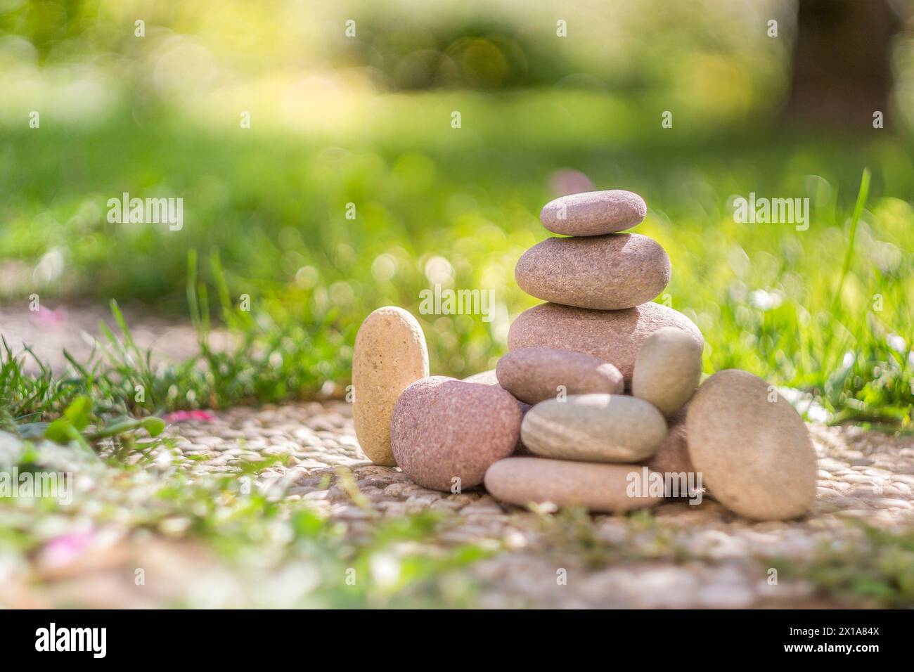 stones balancing  on each other to create a tower of stones for meditation and rest in the nature Stock Photo