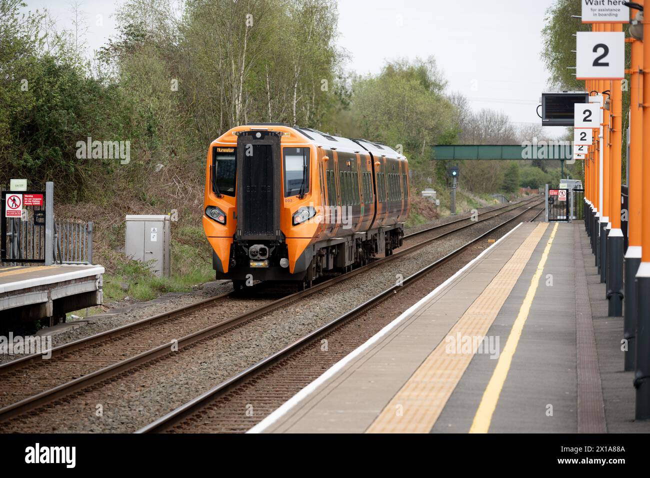 West Midlands Railway class 196 diesel train leaving Coventry Arena station, Coventry, UK Stock Photo