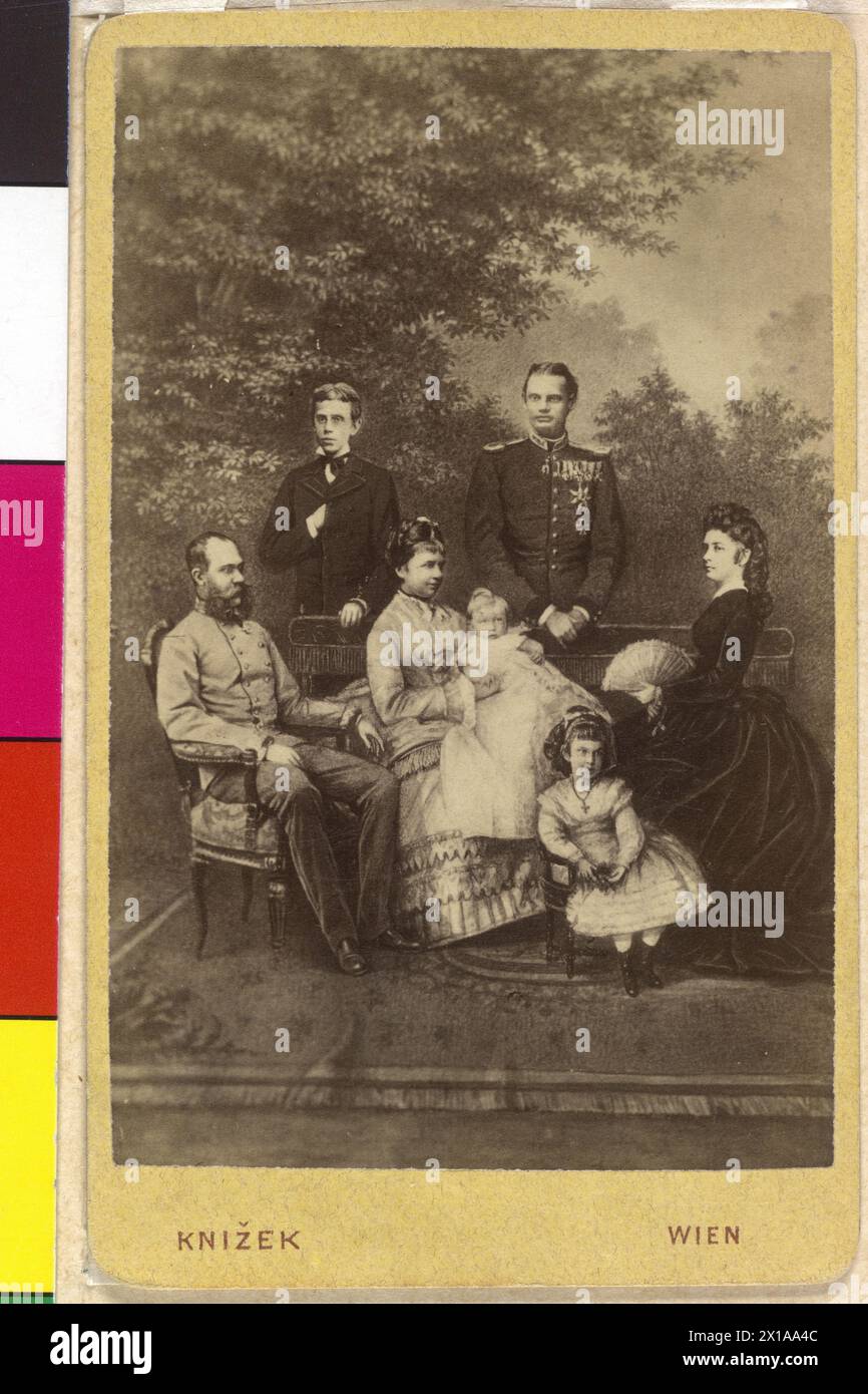 Franz Joseph I, Emperor of Austria with family, family image in composite photograph: Franz Joseph with Elisabeth, in the middle of the whose daughter archduchess Gisela with her children Auguste and Elisabeth, behind standing crown prince Rudolf and Leopold, Prince of Bavaria, background: park scenery, - 18760101 PD0943 - Rechteinfo: Rights Managed (RM) Stock Photo