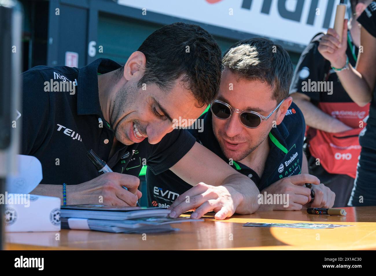 Misano Adriatico, Italy. 14th Apr, 2024. Sebastien Buemi (L) and Robin Frijns (R) of Envision Racing Team during the autograph session at Formula E World Championship Season 10 Pit Line. Credit: SOPA Images Limited/Alamy Live News Stock Photo