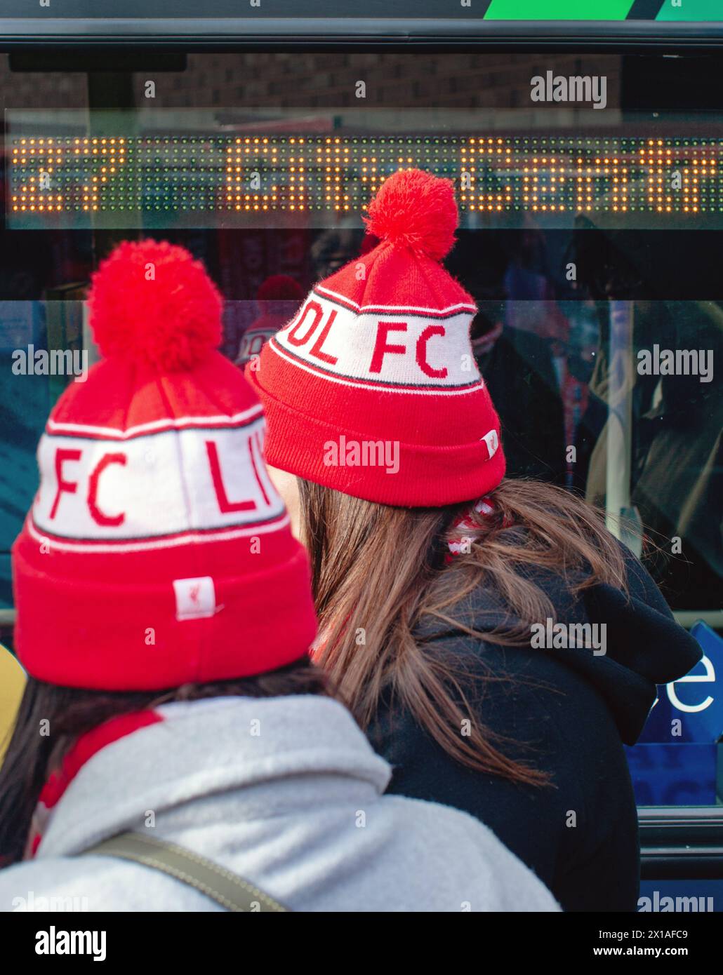 Female Liverpool FC supporter wearing  liverpool fc bobble hat , Liverpool . Stock Photo