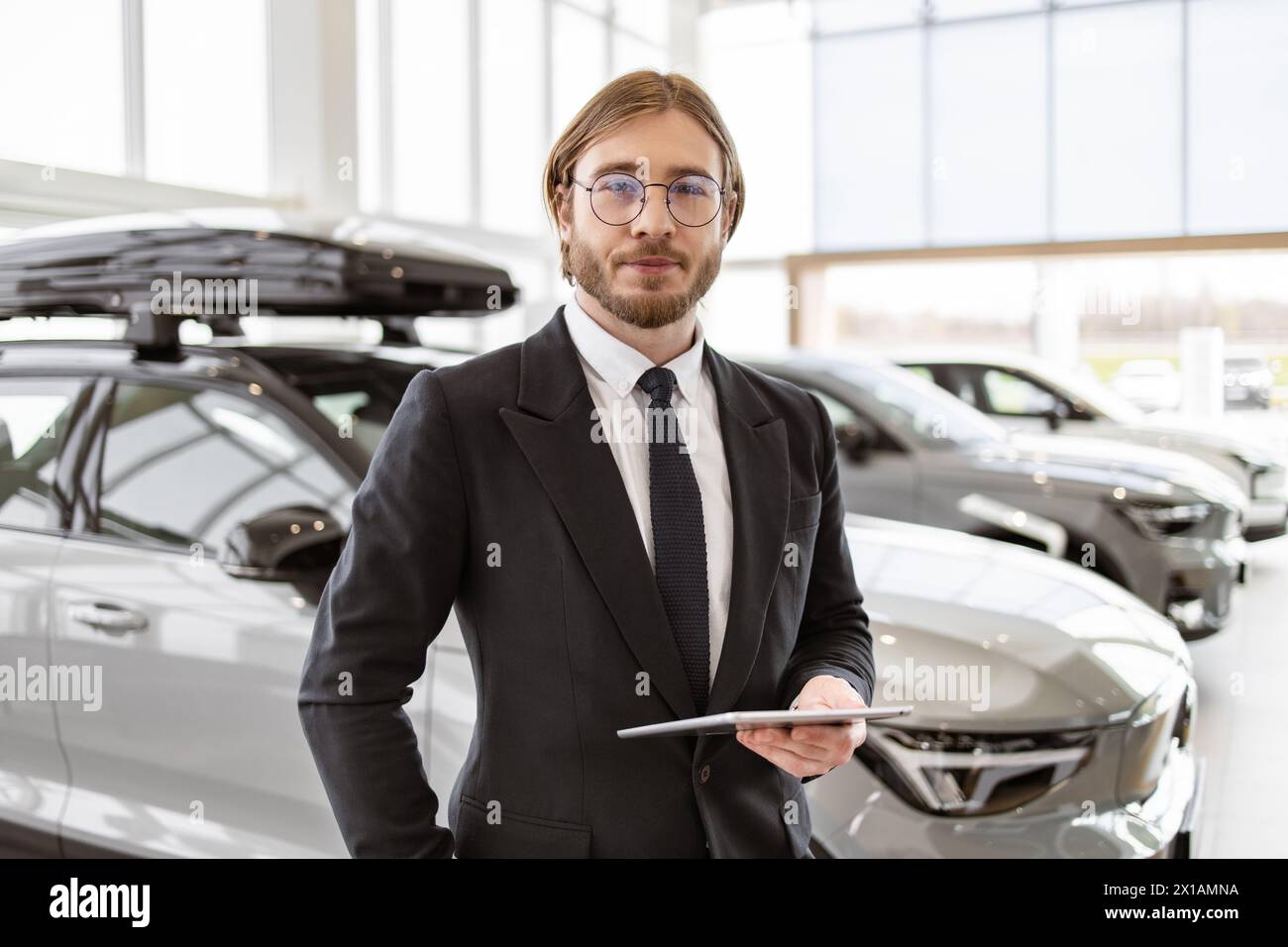 Successful car dealership manager tablet hi-res stock photography and ...