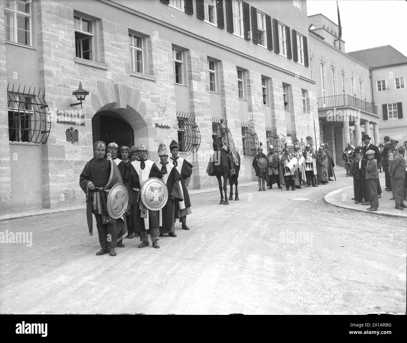 Eisenstadt, procession to the anniversary '10 Jahre Burgenland': costume group 'Roemische Feuerwache' before the building of the state government., 01.09.1931 - 19310901 PD0025 - Rechteinfo: Rights Managed (RM) Stock Photo