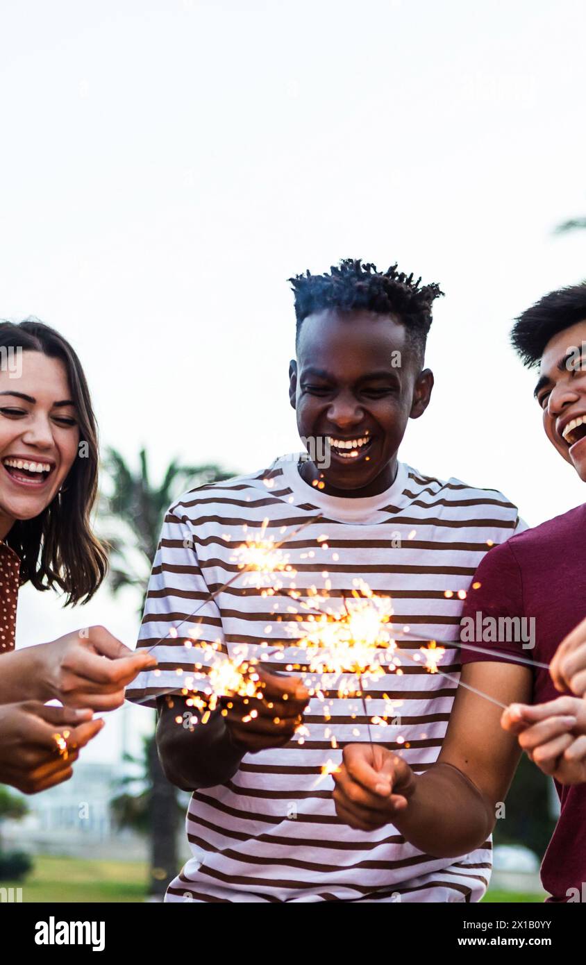 Happy multiracial people enjoying summer party at the beach Stock Photo ...