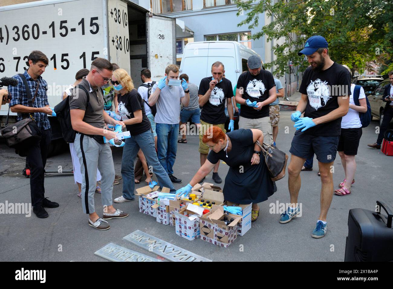 Offensive Lettering Young people activists preparing for action of protest, painting ...