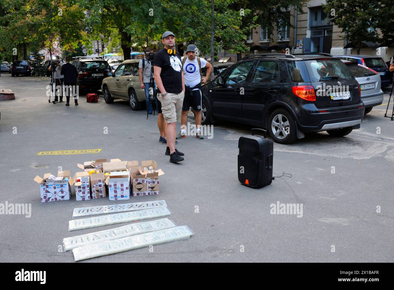 Offensive Lettering Young people activists preparing for action of protest, painting ...