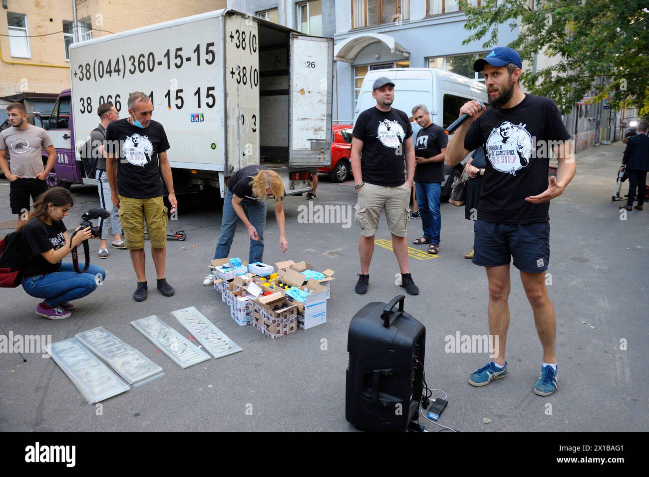 Offensive Lettering Young people activists preparing for action of protest, painting ...