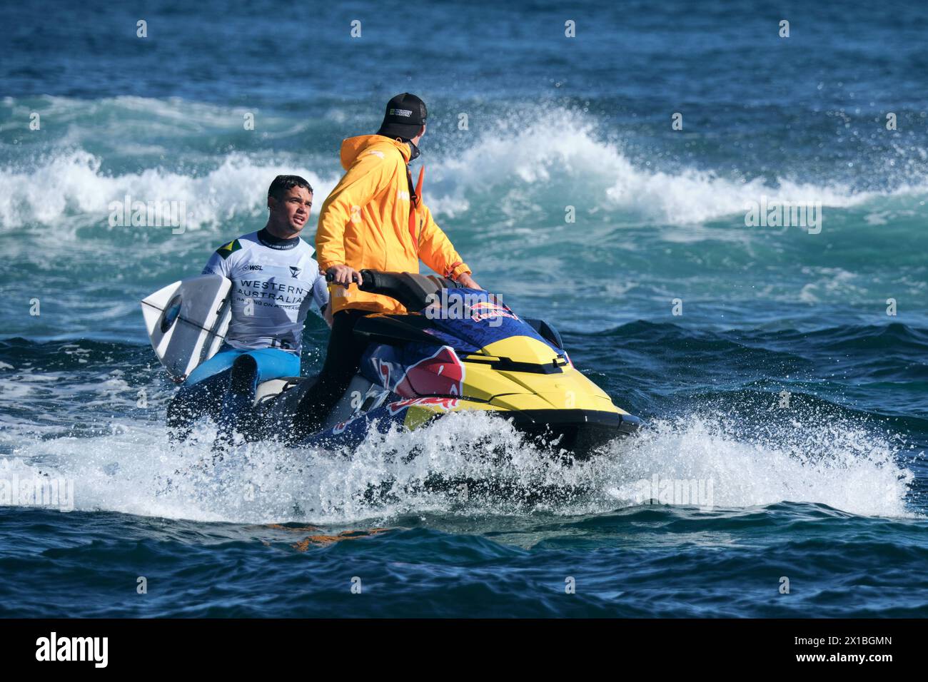 Brazilian professional surfer Deivid Silva returning to shore on the