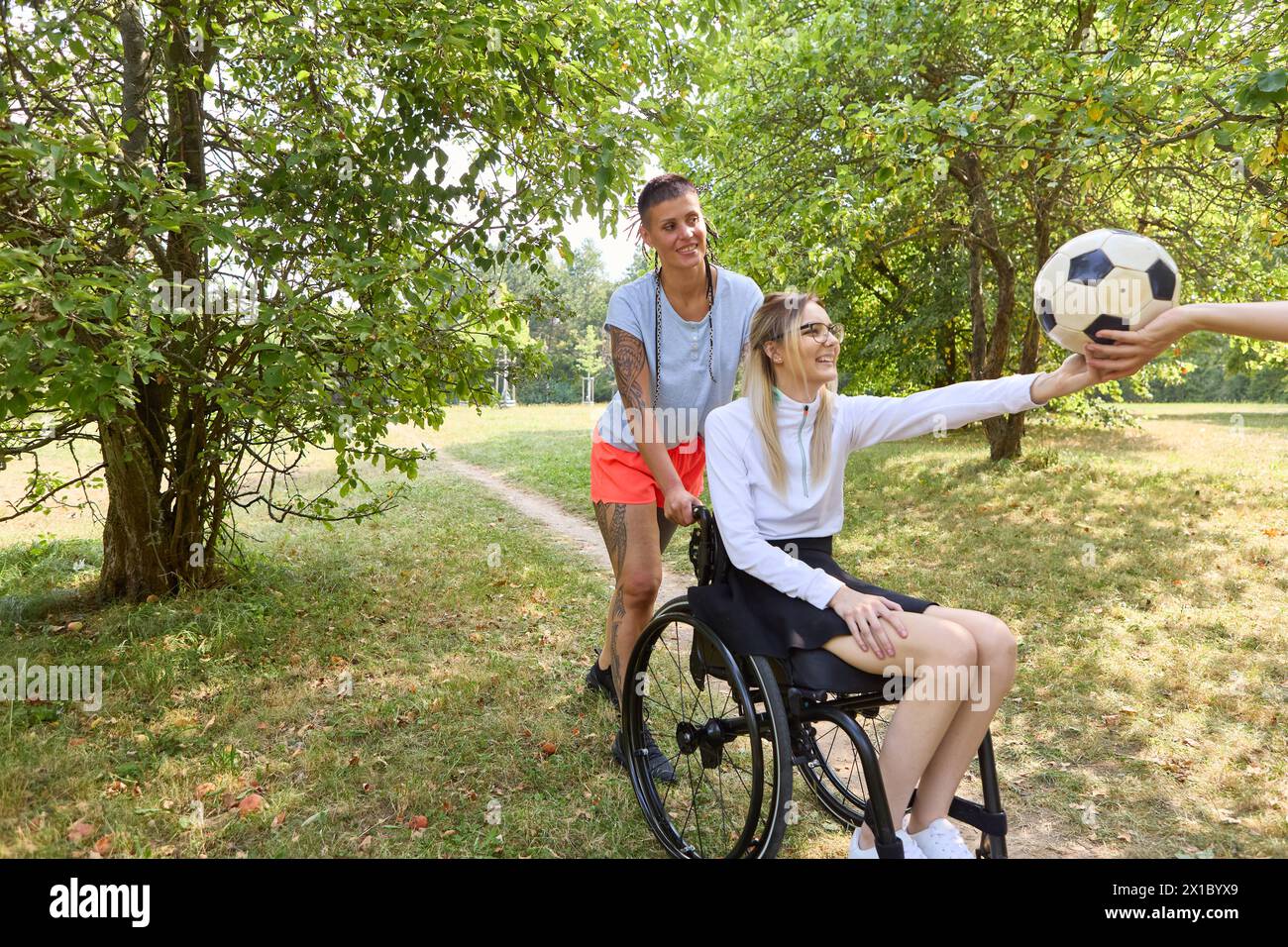 A joyful scene in a park portraying two friends, one being a person ...