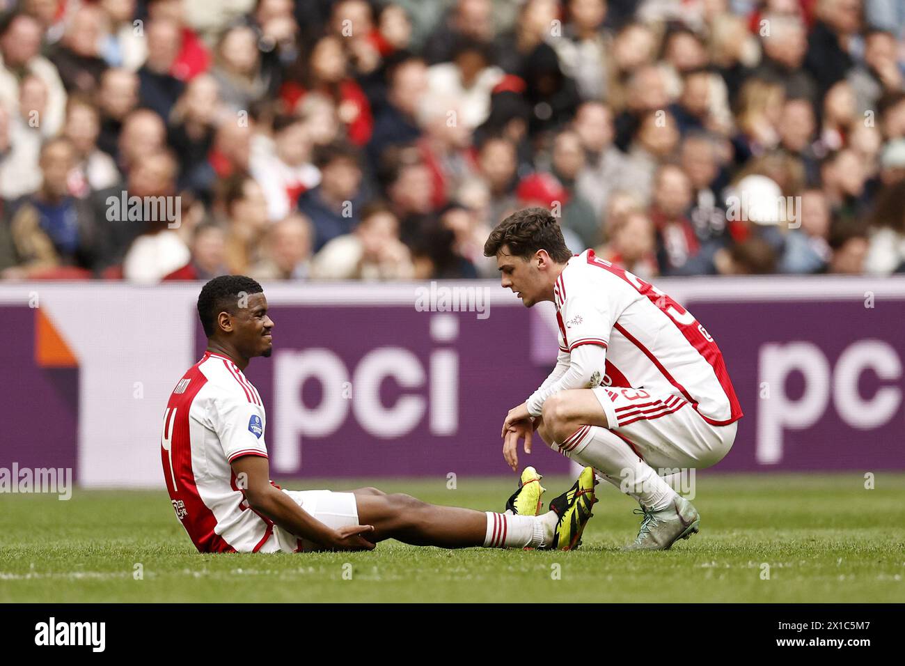 AMSTERDAM - (l-r) Jorrel Hato of Ajax, Benjamin Tahirovic of Ajax during the Dutch Eredivisie match between Ajax Amsterdam and FC Twente at the Johan Cruijff ArenA on April 14, 2024 in Amsterdam, Netherlands. ANP | Hollandse Hoogte | MAURICE VAN STEEN Stock Photo