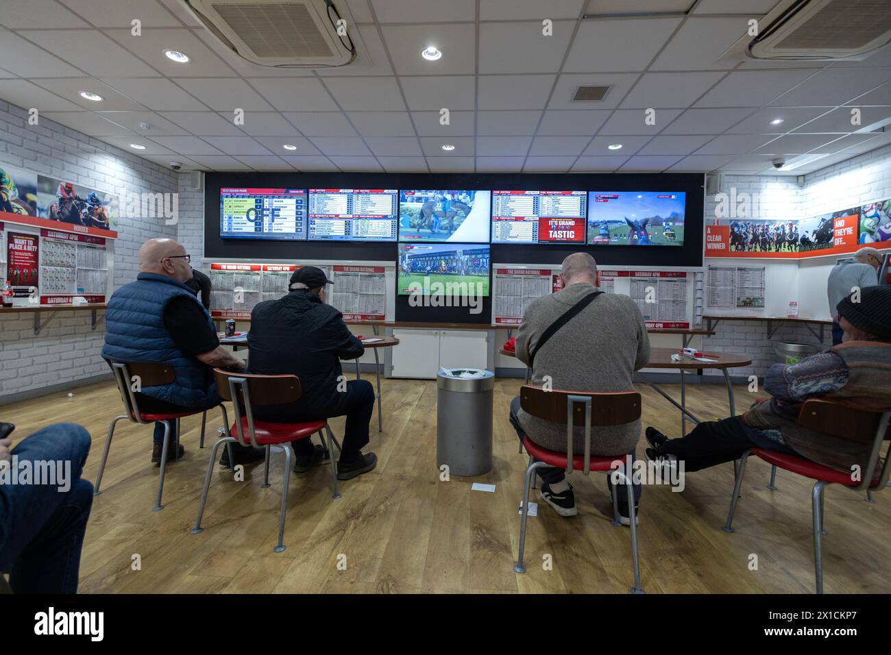 UK betting shop, Ladbrokes on Camden High Street on the day of the Grand National, showing the world's greatest Steeplechase, North London, England UK Stock Photo