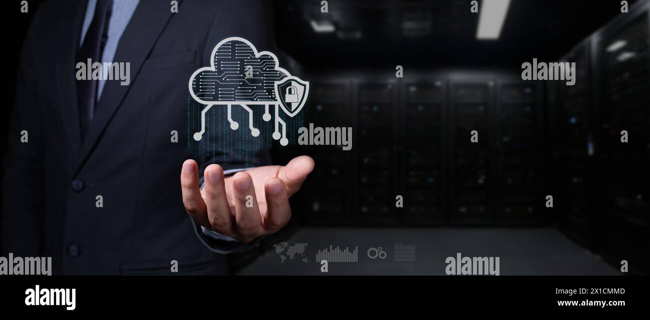 cybersecurity concept. businessman holds cloud hologram with shield and padlock. it rains binary code. Stock Photo