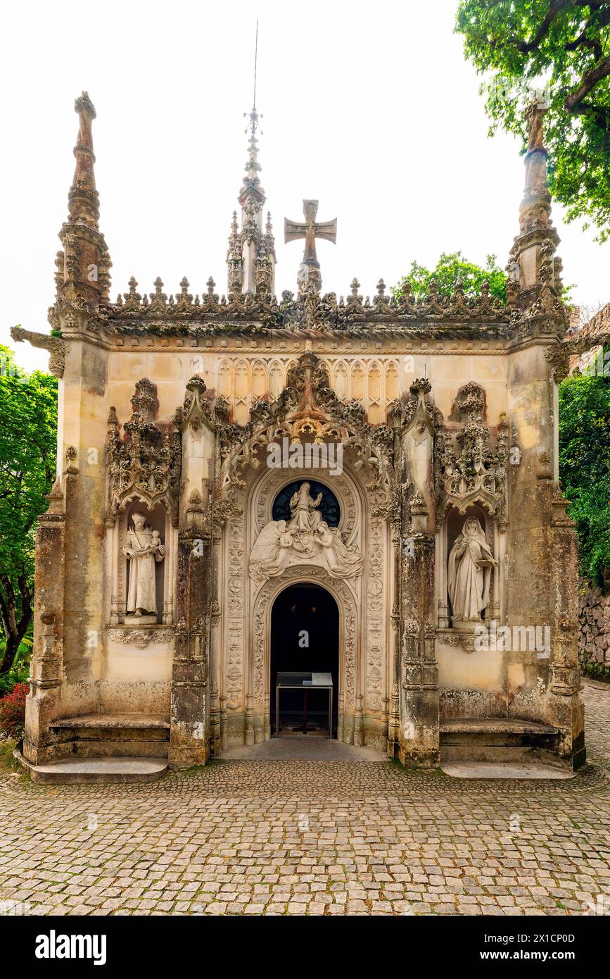 Capela da Santissima Trindade, An ornate chapel with an impressive, neo-gothic tower. Quinta da Regaleira park, Sintra, Portugal Stock Photo