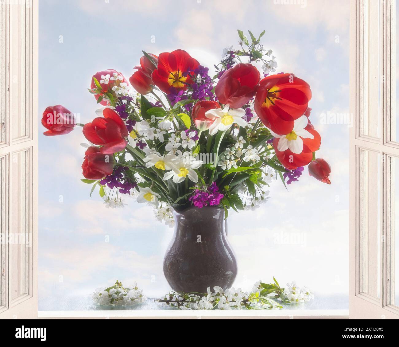 Vase with bouquet of spring flowers on sky background Stock Photo