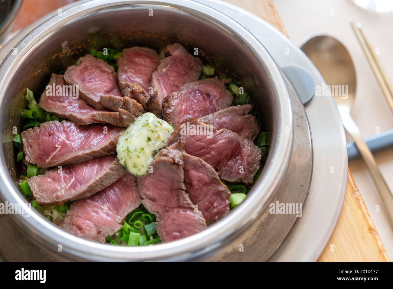 Steamed Beef Rice Rare beef rice in a steamed pot with butter. Korean food Stock Photo ...