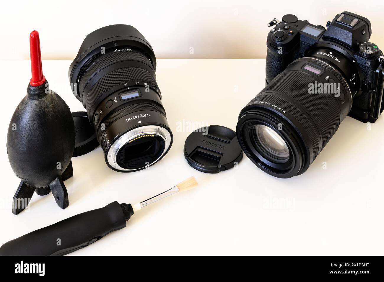 Cleaning a professional camera and lenses following a photoshoot using