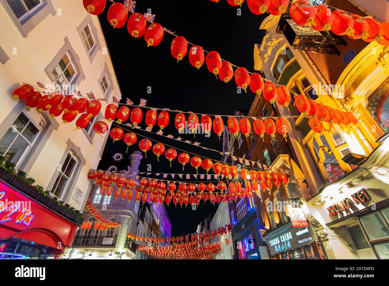 Red chinese lanterns in Gerrard street, Chinatown at night in London, UK Stock Photo