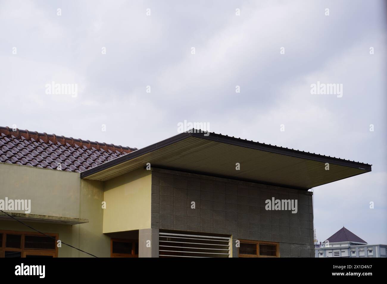 A roof of minimalist house and a blue sky Stock Photo - Alamy