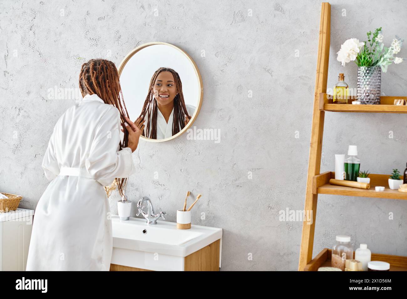 Young black woman braids admiring hi-res stock photography and images ...