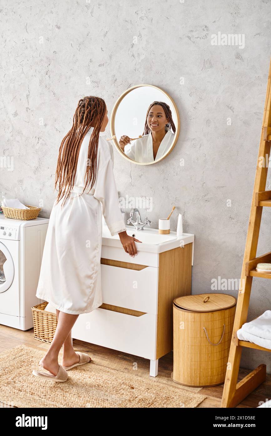Young black woman braids admiring hi-res stock photography and images ...