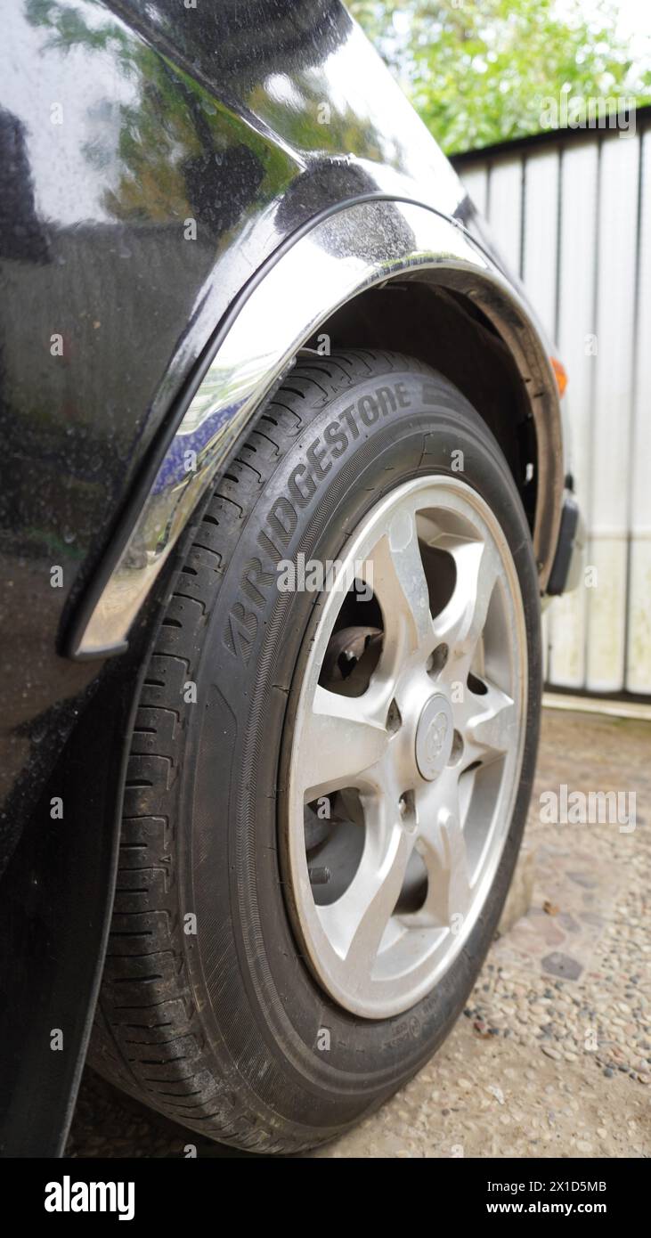 Bridgestone tires from a black Toyota Corolla DX Stock Photo