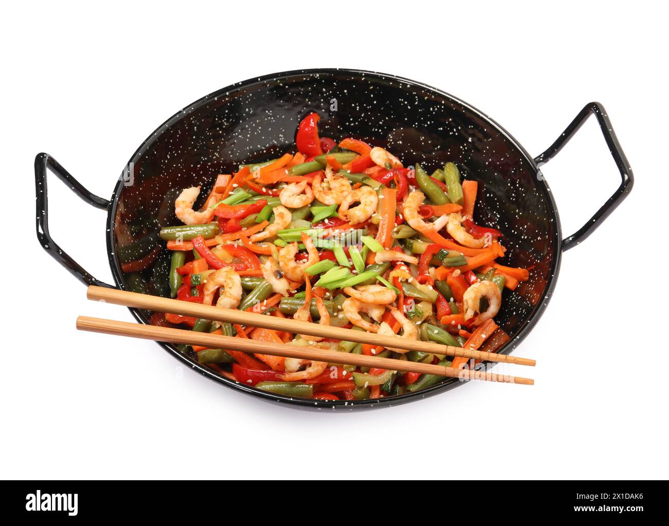 Shrimp stir fry with vegetables in wok and chopsticks on white