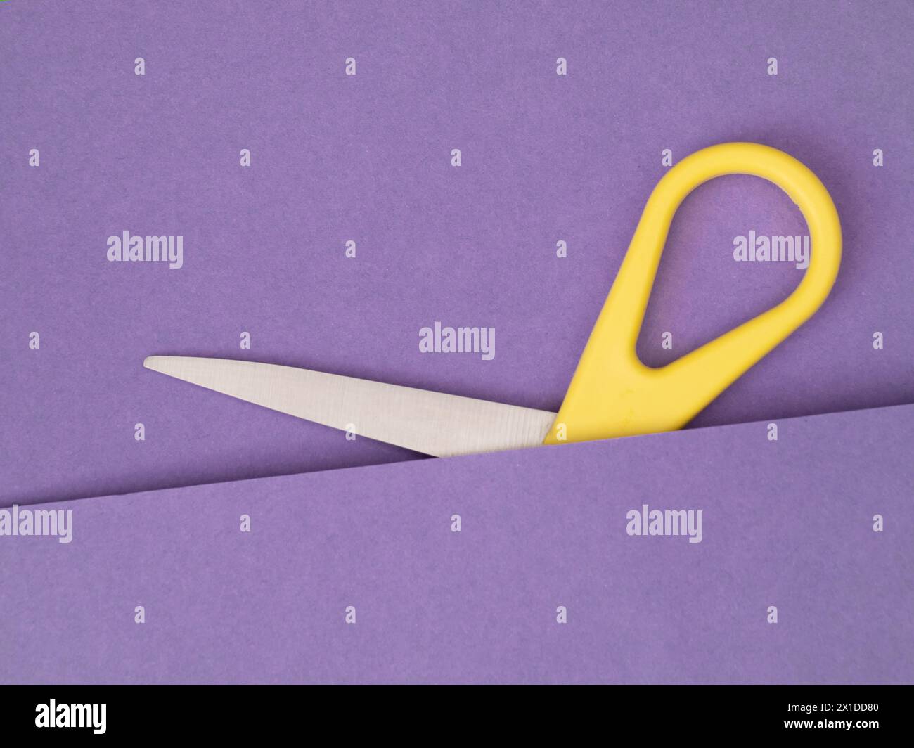 Unusual scissors, part hidden on purple. Unusual Stock Photo - Alamy