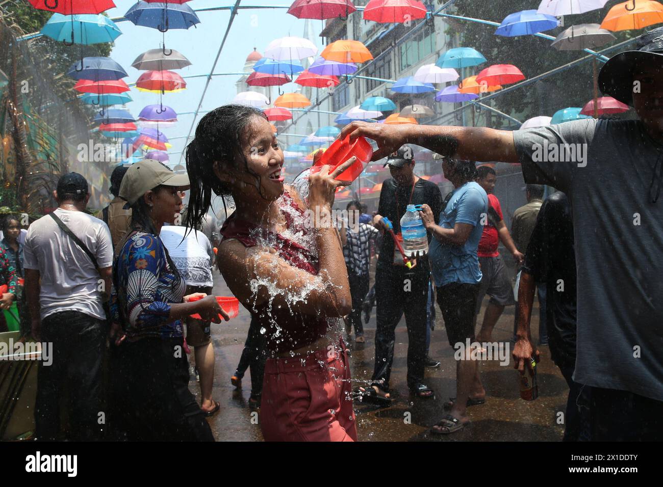 Yangon, Myanmar. 16th Apr, 2024. People celebrate the water festival in Yangon, Myanmar, April 16, 2024. Credit: Myo Kyaw Soe/Xinhua/Alamy Live News Stock Photo