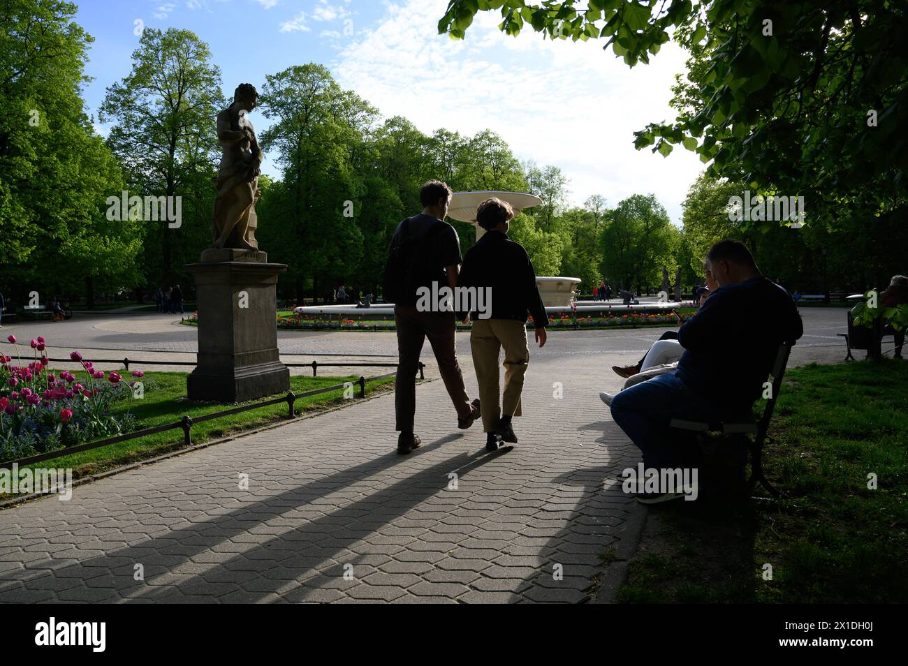 Saxon Palace Reconstruction In Warsaw. People enjoy a sunny afternoon ...