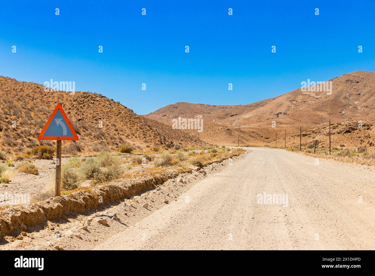 Sharp turn road sign in the Richtersveld National Park, South Africa ...